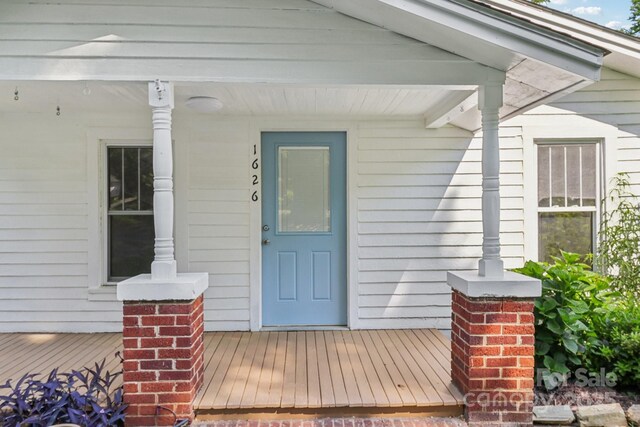 1626 W Park Ave, Albemarle, NC 28001 - view of exterior entry with a porch