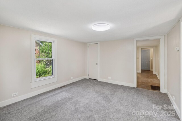 1626 W Park Ave, Albemarle, NC 28001 - spare room with carpet flooring and baseboards