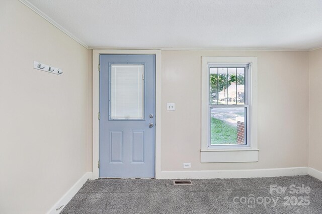 1626 W Park Ave, Albemarle, NC 28001 - carpeted foyer featuring baseboards and crown molding