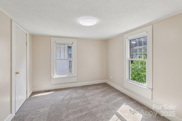 1626 W Park Ave, Albemarle, NC 28001 - carpeted empty room with a textured ceiling and baseboards