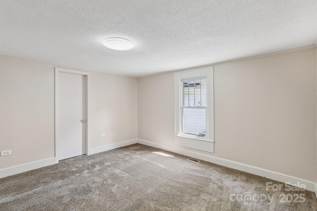 1626 W Park Ave, Albemarle, NC 28001 - carpeted spare room featuring a textured ceiling and baseboards