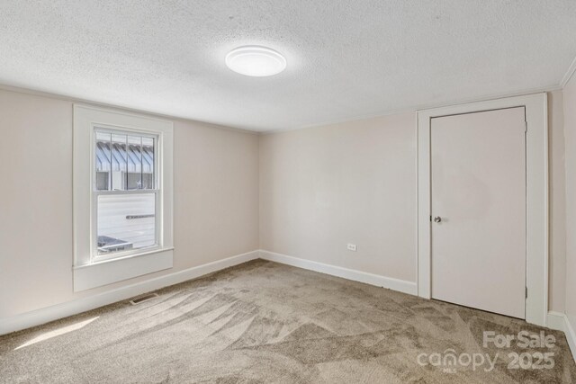 1626 W Park Ave, Albemarle, NC 28001 - carpeted empty room with a textured ceiling and baseboards
