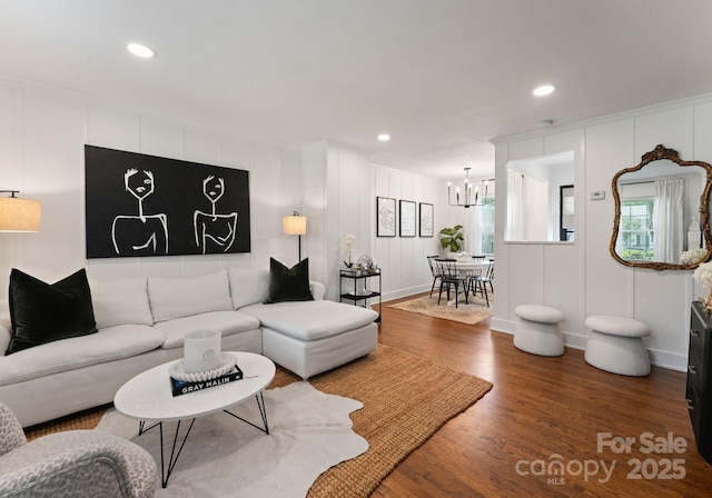 504 Wakefield Dr Unit A, Charlotte, NC 28209 - living area with a chandelier, a decorative wall, wood finished floors, and recessed lighting