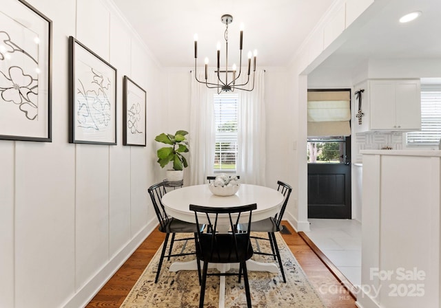 504 Wakefield Dr Unit A, Charlotte, NC 28209 - dining room with a chandelier and wood finished floors