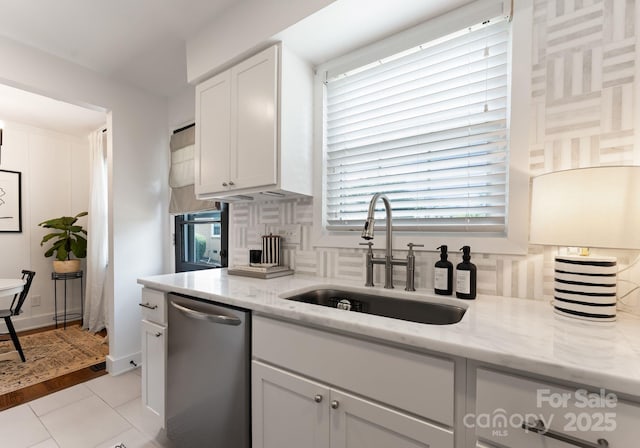 504 Wakefield Dr Unit A, Charlotte, NC 28209 - kitchen featuring dishwasher, white cabinetry, decorative backsplash, and light stone countertops
