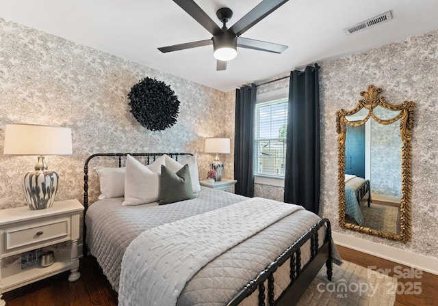 504 Wakefield Dr Unit A, Charlotte, NC 28209 - bedroom with wallpapered walls, wood finished floors, and ceiling fan