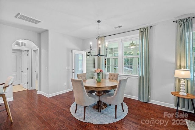 1335 Bryson Gap Dr, Fort Mill, SC 29715 - dining area with arched walkways, wood finished floors, and a chandelier