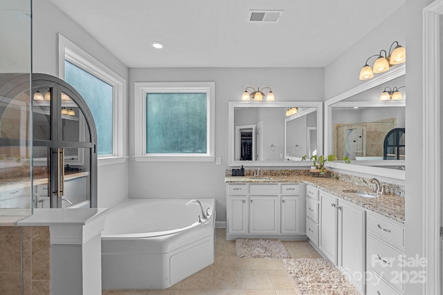 1335 Bryson Gap Dr, Fort Mill, SC 29715 - bathroom with double vanity, a garden tub, tile patterned flooring, tiled shower, and recessed lighting