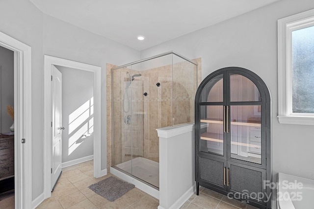 1335 Bryson Gap Dr, Fort Mill, SC 29715 - bathroom with a stall shower, plenty of natural light, tile patterned floors, and recessed lighting
