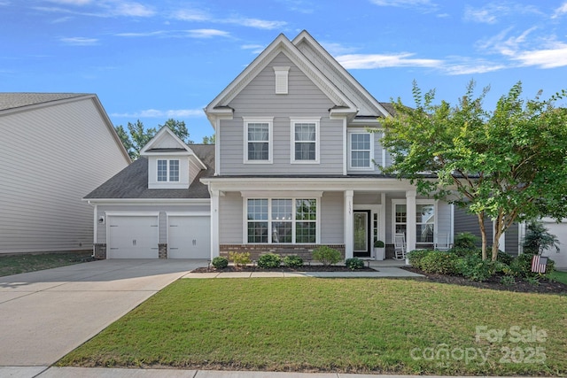 1335 Bryson Gap Dr, Fort Mill, SC 29715 - view of front of home with driveway, a front yard, an attached garage, a porch, and roof with shingles