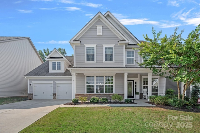1335 Bryson Gap Dr, Fort Mill, SC 29715 - view of front facade featuring concrete driveway, a front yard, a porch, brick siding, and a garage