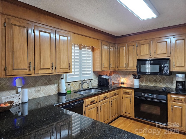 217 Rock Creek Dr, Lincolnton, NC 28092 - kitchen with black appliances, crown molding, light wood-style floors, dark stone counters, and tasteful backsplash