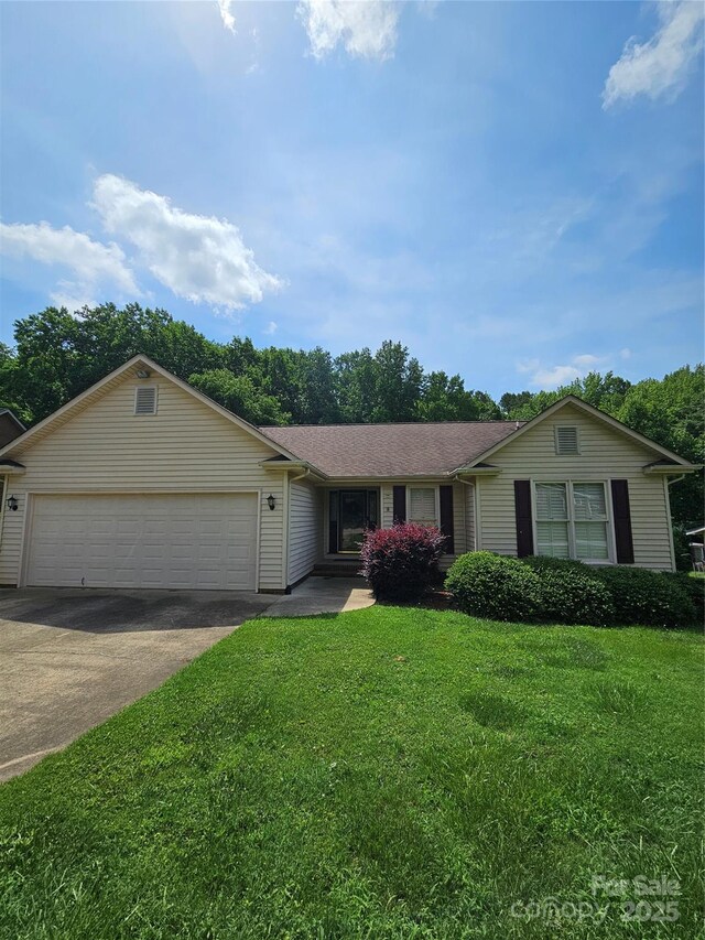 217 Rock Creek Dr, Lincolnton, NC 28092 - ranch-style home featuring a garage, driveway, a front lawn, and roof with shingles