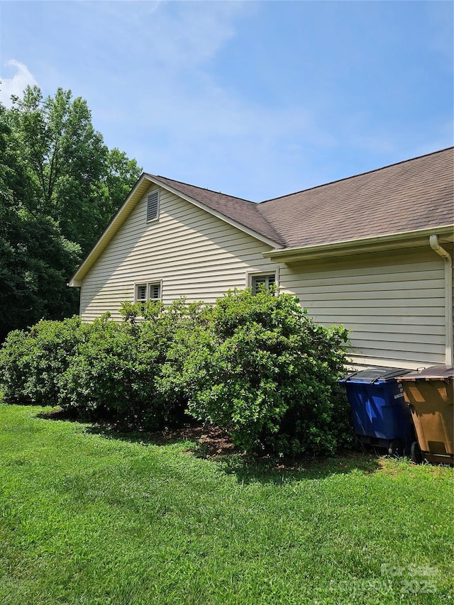 217 Rock Creek Dr, Lincolnton, NC 28092 - view of side of property with a yard and roof with shingles
