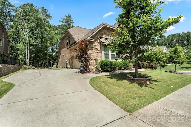 16402 Doves Canyon Ln, Charlotte, NC 28278 - view of front of property with stone siding, concrete driveway, a front lawn, and an attached garage