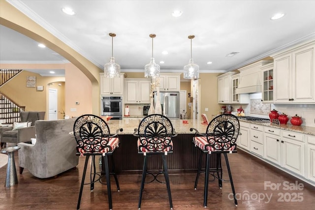 16402 Doves Canyon Ln, Charlotte, NC 28278 - kitchen featuring stainless steel appliances, a breakfast bar, light stone counters, decorative backsplash, and recessed lighting