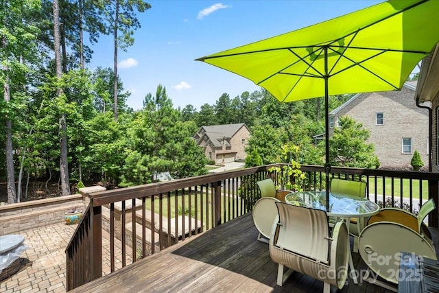 16402 Doves Canyon Ln, Charlotte, NC 28278 - wooden deck featuring outdoor dining area and view of wooded area