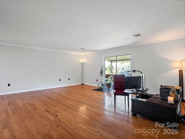 263 Fairway Ln Unit H, Spruce Pine, NC 28777 - living area with crown molding, wood finished floors, and a desk