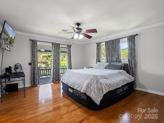 263 Fairway Ln Unit H, Spruce Pine, NC 28777 - bedroom featuring access to exterior, multiple windows, wood finished floors, ornamental molding, and a ceiling fan