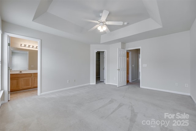 764 Atherton Way, Rock Hill, SC 29730 - unfurnished bedroom with a raised ceiling, light colored carpet, ensuite bathroom, a walk in closet, and a ceiling fan