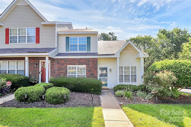 5980 Cougar Ln, Charlotte, NC 28269 - traditional-style home with brick siding and a shingled roof