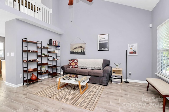 5980 Cougar Ln, Charlotte, NC 28269 - living area with a high ceiling, wood finish floors, and a ceiling fan