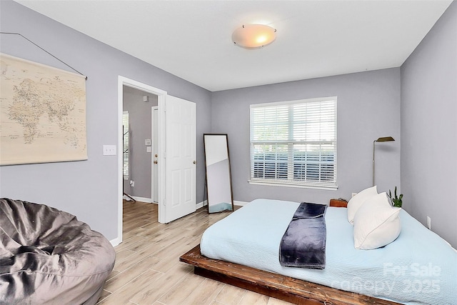 5980 Cougar Ln, Charlotte, NC 28269 - bedroom featuring light wood finished floors and baseboards
