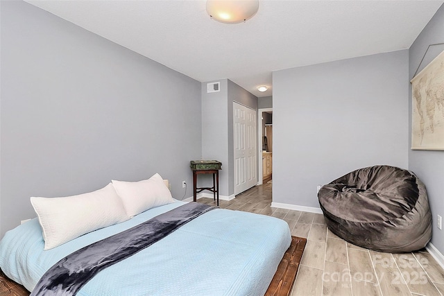 5980 Cougar Ln, Charlotte, NC 28269 - bedroom featuring wood finish floors and a closet