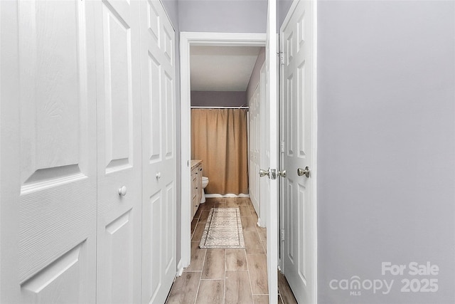 5980 Cougar Ln, Charlotte, NC 28269 - hallway featuring light wood finished floors