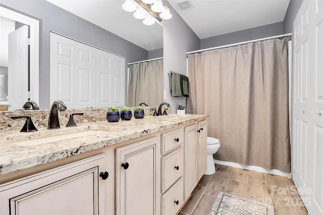 5980 Cougar Ln, Charlotte, NC 28269 - full bathroom with double vanity and curtained shower