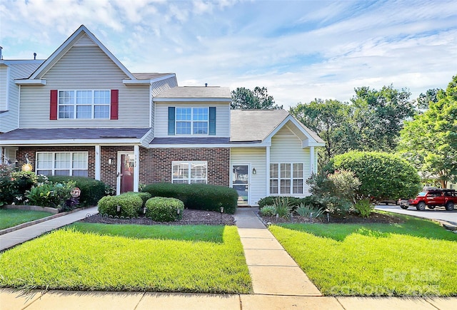 5980 Cougar Ln, Charlotte, NC 28269 - view of front of home with a front lawn and brick siding
