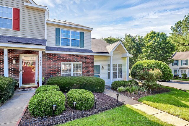 5980 Cougar Ln, Charlotte, NC 28269 - traditional-style house with brick siding and a shingled roof