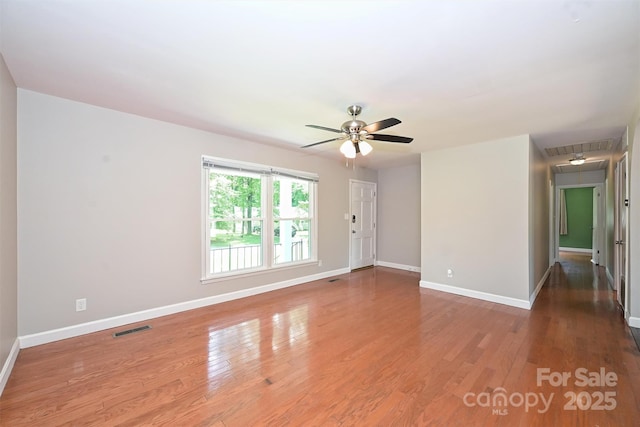 3729 Woodleaf Rd, Charlotte, NC 28205 - spare room featuring attic access, wood finished floors, and a ceiling fan