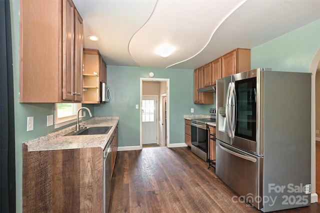 3729 Woodleaf Rd, Charlotte, NC 28205 - kitchen featuring appliances with stainless steel finishes, under cabinet range hood, dark wood-style floors, and plenty of natural light