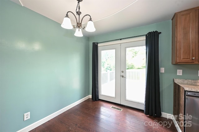 3729 Woodleaf Rd, Charlotte, NC 28205 - unfurnished dining area featuring french doors, a chandelier, and dark wood-type flooring