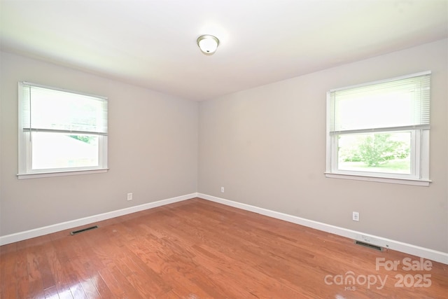 3729 Woodleaf Rd, Charlotte, NC 28205 - empty room featuring healthy amount of natural light and light wood-style flooring