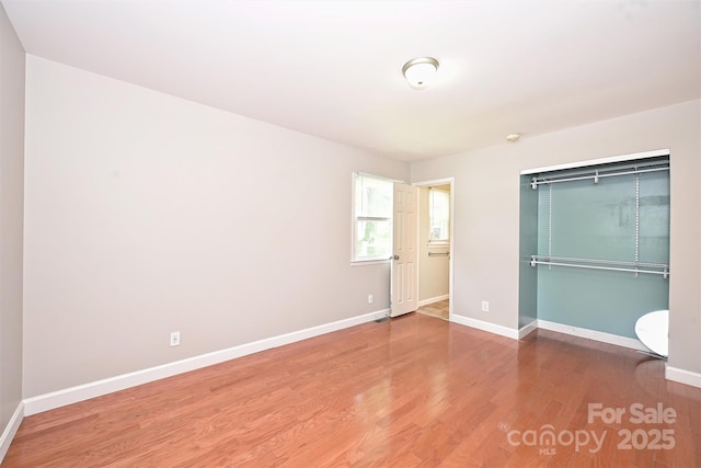 3729 Woodleaf Rd, Charlotte, NC 28205 - unfurnished bedroom featuring wood finished floors and a closet