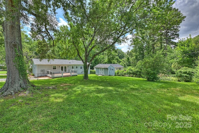 3729 Woodleaf Rd, Charlotte, NC 28205 - view of grassy yard featuring a deck and a storage shed