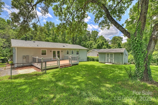 3729 Woodleaf Rd, Charlotte, NC 28205 - back of property featuring a wooden deck, a storage unit, a lawn, and french doors