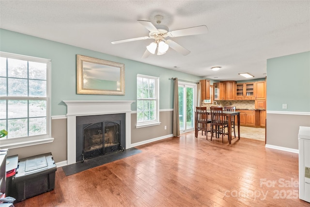 1276 Winding Path Rd, Clover, SC 29710 - living room with a fireplace with flush hearth, ceiling fan, and light wood finished floors
