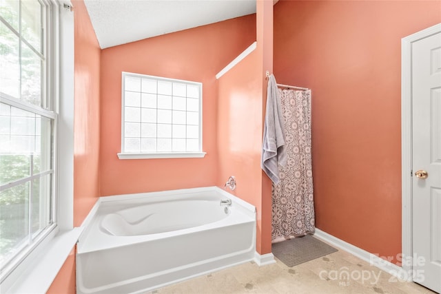 1276 Winding Path Rd, Clover, SC 29710 - full bathroom with a garden tub, lofted ceiling, and healthy amount of natural light