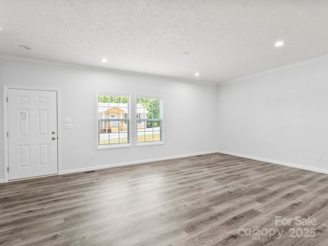 207 Walnut Branch Rd, Weaverville, NC 28787 - unfurnished room featuring ornamental molding, recessed lighting, wood finished floors, and a textured ceiling