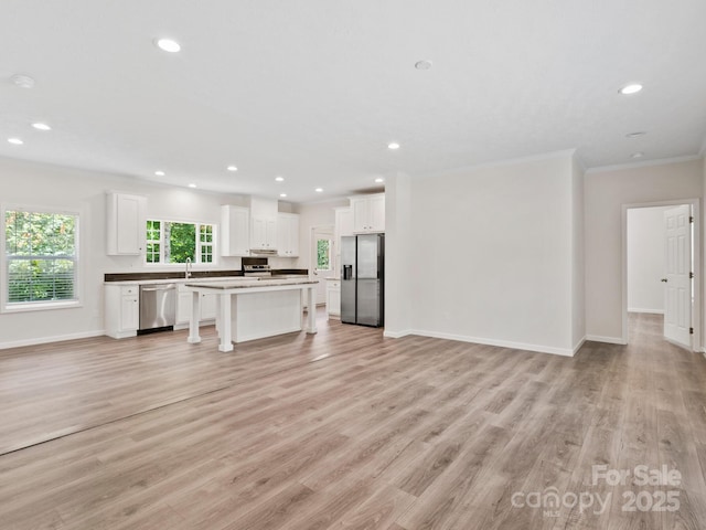 207 Walnut Branch Rd, Weaverville, NC 28787 - unfurnished living room with crown molding, recessed lighting, and light wood-style floors