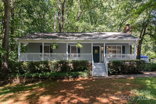1118 Brookwood Dr, Stanley, NC 28164 - view of front of property with covered porch and a chimney