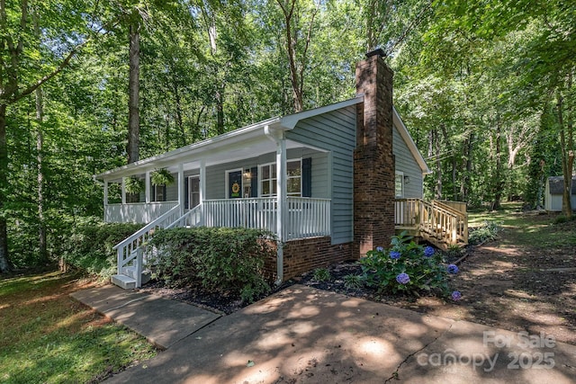 1118 Brookwood Dr, Stanley, NC 28164 - view of front of home featuring stairs, covered porch, and a chimney
