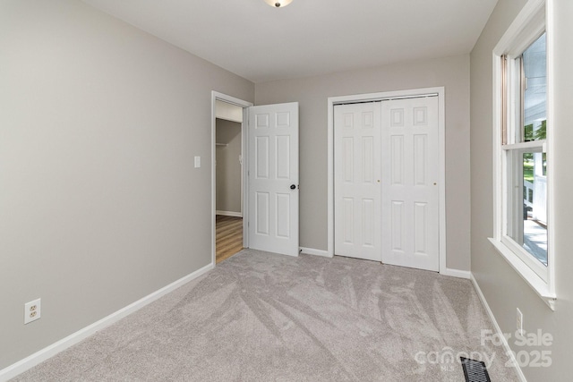 1118 Brookwood Dr, Stanley, NC 28164 - unfurnished bedroom featuring carpet floors and a closet