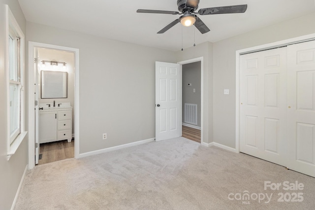 1118 Brookwood Dr, Stanley, NC 28164 - unfurnished bedroom with carpet flooring, a closet, connected bathroom, and ceiling fan