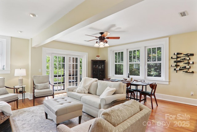 203 6th Ave W Unit 2A, Hendersonville, NC 28739 - living area with light wood-style floors, ceiling fan, and beamed ceiling