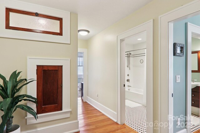 203 6th Ave W Unit 2A, Hendersonville, NC 28739 - corridor featuring light wood-style floors and baseboards