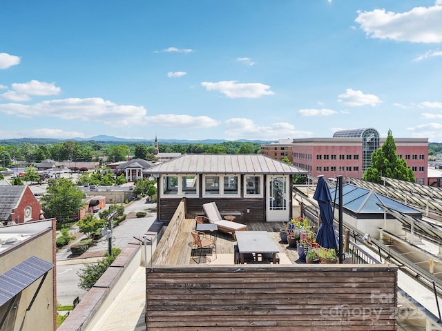 203 6th Ave W Unit 2A, Hendersonville, NC 28739 - back of property with a metal roof, a standing seam roof, and a deck with mountain view